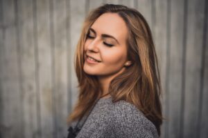 blonde model woman with eyes closed and smile